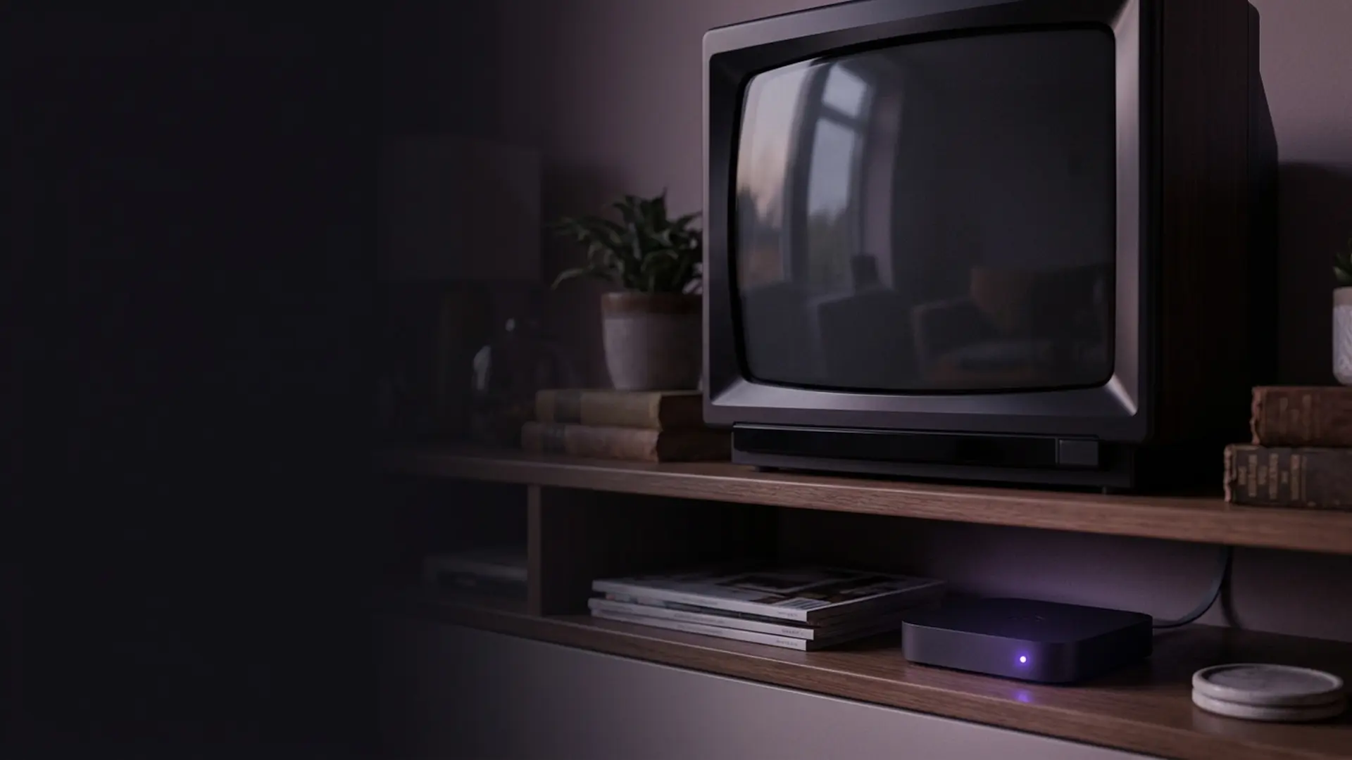 Two compact television boxes beneath a television